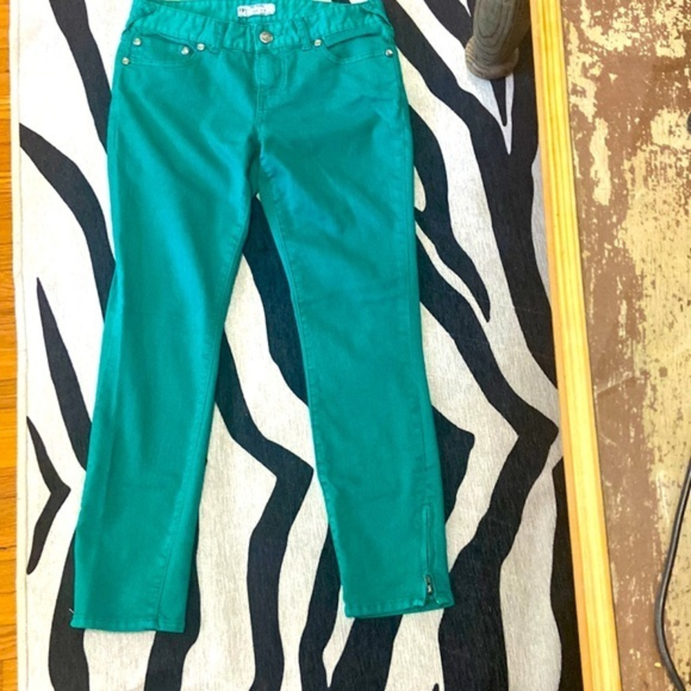 Free People green jeans with‎ zippers by ankles